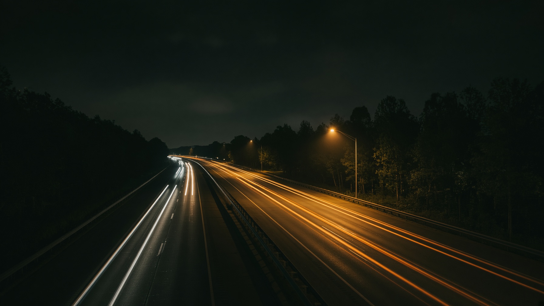 Night highway with streaks of headlights and taillights